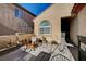 Small front patio with seating and potted plants at 2694 Kinghorn Pl, Henderson, NV 89044