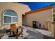 Small front patio with seating and a mailbox at 2694 Kinghorn Pl, Henderson, NV 89044