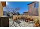 Front patio with seating, potted plants, and a gate at 2694 Kinghorn Pl, Henderson, NV 89044