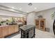 Spacious kitchen with island, cabinetry, and views into Gathering room at 2694 Kinghorn Pl, Henderson, NV 89044