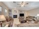 Comfortable living room with fireplace and a large TV at 2694 Kinghorn Pl, Henderson, NV 89044