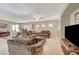 Spacious living room with tile floors and a fireplace at 2694 Kinghorn Pl, Henderson, NV 89044