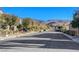 Residential street with mountain views and parked cars at 2694 Kinghorn Pl, Henderson, NV 89044