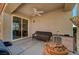 Covered patio with wicker furniture, sliding door and grill at 2694 Kinghorn Pl, Henderson, NV 89044