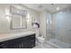 Contemporary bathroom with dark vanity and walk-in shower at 2700 Las Vegas Blvd # 809, Las Vegas, NV 89109