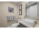 Modern bathroom with gray vanity, white sink, and large mirror at 2700 Las Vegas Blvd # 809, Las Vegas, NV 89109