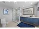 Elegant bathroom with blue vanity, marble shower, and large mirror at 2700 Las Vegas Blvd # 809, Las Vegas, NV 89109