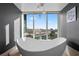 Modern bathroom featuring a freestanding tub and city views at 2700 Las Vegas Blvd # 809, Las Vegas, NV 89109