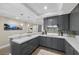 Modern kitchen with gray cabinets, white countertops, and tiled backsplash at 2700 Las Vegas Blvd # 809, Las Vegas, NV 89109