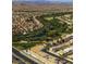 Aerial view of community with houses, golf course and mountain views at 272 Arbour Garden Ave, Las Vegas, NV 89148