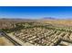 Aerial view of community with houses, golf course and mountain views at 272 Arbour Garden Ave, Las Vegas, NV 89148