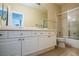 Clean bathroom with double sinks and shower/tub combo at 272 Arbour Garden Ave, Las Vegas, NV 89148