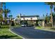 Gated community entrance with guard house and landscaped entry at 272 Arbour Garden Ave, Las Vegas, NV 89148