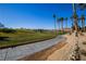 Golf course pathway with palm trees and mountain views at 272 Arbour Garden Ave, Las Vegas, NV 89148