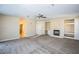 Spacious living room featuring a fireplace and built-in shelving at 272 Arbour Garden Ave, Las Vegas, NV 89148