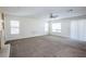 Bright living room with ceiling fan and neutral carpet at 272 Arbour Garden Ave, Las Vegas, NV 89148