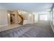 Two-story living room with hardwood floors and staircase at 272 Arbour Garden Ave, Las Vegas, NV 89148