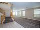 Spacious living room with hardwood floors and staircase at 272 Arbour Garden Ave, Las Vegas, NV 89148