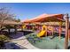 Community playground with shaded areas and play structures at 272 Arbour Garden Ave, Las Vegas, NV 89148