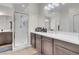 Modern bathroom with double vanity and walk-in shower at 320 Via Del Duomo, Henderson, NV 89011