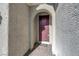 Front entrance with a dark-red door and brick flooring at 320 Via Del Duomo, Henderson, NV 89011