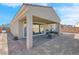 Home exterior showcasing covered patio and hot tub at 320 Via Del Duomo, Henderson, NV 89011