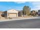 Single-story house with a two-car garage and desert landscaping at 320 Via Del Duomo, Henderson, NV 89011