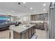 Modern kitchen with an island, stainless steel appliances, and granite countertops at 320 Via Del Duomo, Henderson, NV 89011