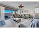 Relaxing living room with large sectional sofa and sliding glass doors to backyard at 320 Via Del Duomo, Henderson, NV 89011