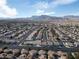 An elevated view showcasing a community's layout and its beautiful mountain backdrop at 3335 Cheltenham St, Las Vegas, NV 89129