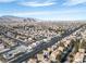 Expansive aerial of a residential area with neat rows of homes and distant mountains at 3335 Cheltenham St, Las Vegas, NV 89129