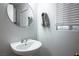 Bathroom showcasing a modern sink, mirror, and neutral color scheme at 3335 Cheltenham St, Las Vegas, NV 89129