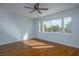 Bright bedroom with three windows and wood flooring, creating a welcoming atmosphere at 3335 Cheltenham St, Las Vegas, NV 89129