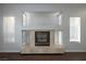 The neutral-toned fireplace features a tiled hearth and surround in the spacious living room at 3335 Cheltenham St, Las Vegas, NV 89129