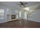 Bright living room with a fireplace, modern hardwood floors, and access to the backyard at 3335 Cheltenham St, Las Vegas, NV 89129