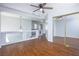 Open loft area with wood floors, contemporary lighting, and glass railing overlooking the staircase at 3335 Cheltenham St, Las Vegas, NV 89129