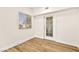 Bright bedroom with wood-look flooring and access to a patio at 3400 Cabana Dr # 1108, Las Vegas, NV 89122