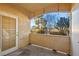 Private patio with a door and views of trees at 3400 Cabana Dr # 1108, Las Vegas, NV 89122