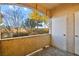 Private patio with views of trees and a fence at 3400 Cabana Dr # 1108, Las Vegas, NV 89122