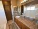 Bathroom with granite vanity, bathtub, and window with mountain view at 3550 Bay Sands Dr # 3073, Laughlin, NV 89029