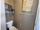 Small powder room with toilet and decorative wall art at 3550 Bay Sands Dr # 3073, Laughlin, NV 89029