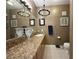 Elegant bathroom with granite vanity and chandelier at 3550 Bay Sands Dr # 3073, Laughlin, NV 89029