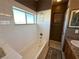 Clean bathroom with a bathtub, window, and tiled walls at 3550 Bay Sands Dr # 3073, Laughlin, NV 89029