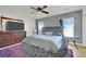 Round bed in spacious bedroom with a large TV and dresser at 4151 San Cuervo Way, Las Vegas, NV 89115