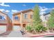 Two-story house with attached garage and landscaped front yard at 4151 San Cuervo Way, Las Vegas, NV 89115