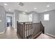 Upstairs hallway with light grey walls and dark wood railings at 4151 San Cuervo Way, Las Vegas, NV 89115