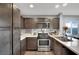 Modern kitchen with stainless steel appliances and dark brown cabinets at 4151 San Cuervo Way, Las Vegas, NV 89115