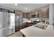 Kitchen with stainless steel appliances and dark brown cabinets at 4151 San Cuervo Way, Las Vegas, NV 89115