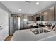 Modern kitchen with stainless steel appliances and light quartz countertops at 4151 San Cuervo Way, Las Vegas, NV 89115