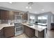 Modern kitchen with stainless steel appliances and an island at 4151 San Cuervo Way, Las Vegas, NV 89115